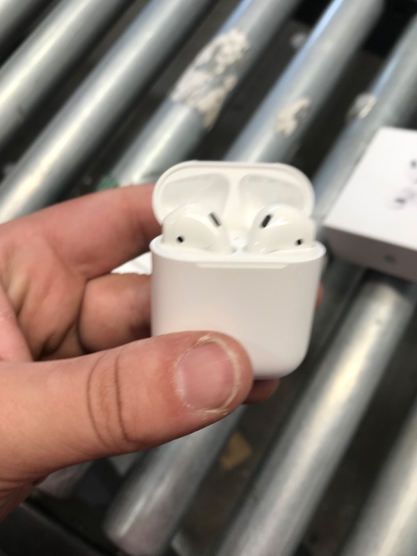 Photo 2 of Apple AirPods (2nd Generation) Wireless Earbuds with Lightning Charging Case Included. Over 24 Hours of Battery Life, Effortless Setup. Bluetooth Headphones for iPhone