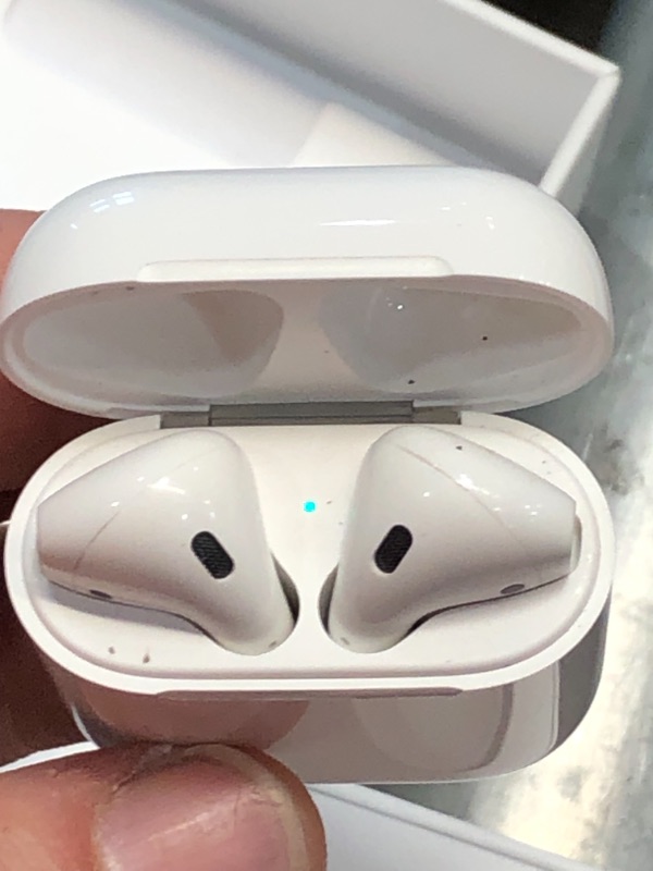 Photo 2 of Apple AirPods (2nd Generation) Wireless Earbuds with Lightning Charging Case Included. Over 24 Hours of Battery Life, Effortless Setup. Bluetooth Headphones for iPhone