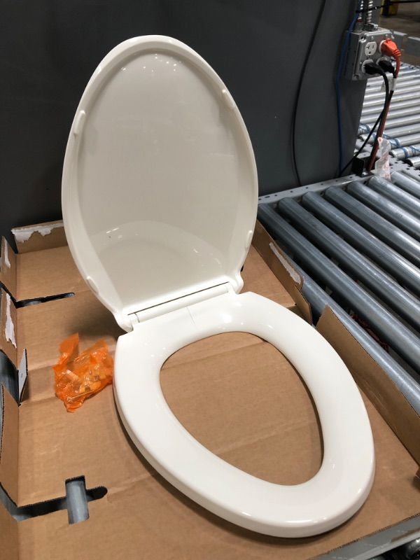 Photo 2 of *CRACKED* KOHLER K-4636-96 Cachet Quiet Close Toilet Seat, Biscuit, Elongated
