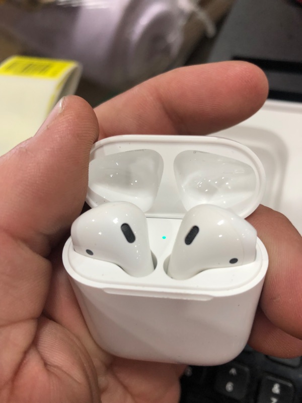 Photo 2 of Apple AirPods (2nd Generation) Wireless Earbuds with Lightning Charging Case Included. Over 24 Hours of Battery Life, Effortless Setup. Bluetooth Headphones for iPhone