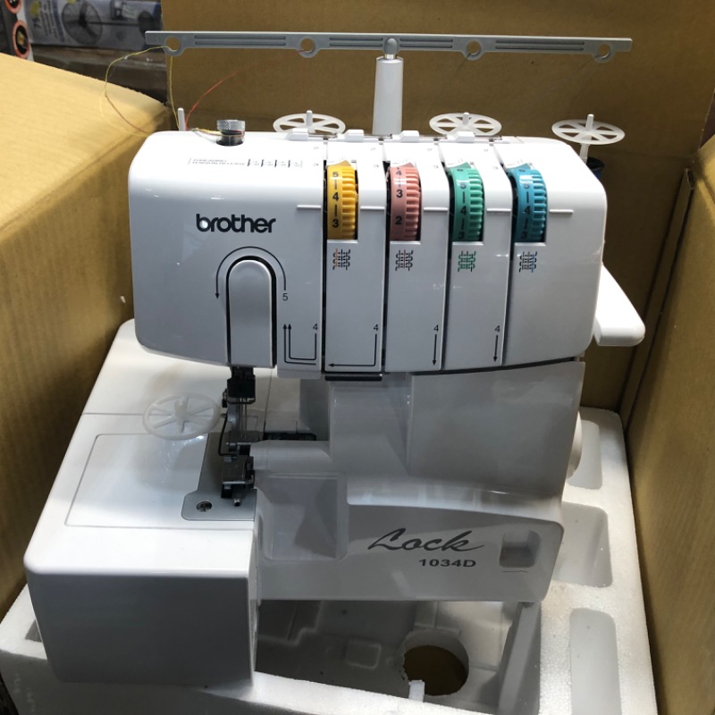 Photo 2 of ***PARTS ONLY*** Brother Serger, 1034D, Heavy-Duty Metal Frame Overlock Machine, 1,300 Stitches Per Minute, Removeable Trim Trap, 3 Included Accessory Feet,White
