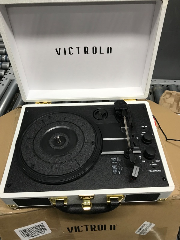 Photo 2 of Victrola Vintage 3-Speed Bluetooth Portable Suitcase Record Player with Built-in Speakers | Upgraded Turntable Audio Sound| White (VSC-550BT-WH) White Record Player  NEEDS REPAIR