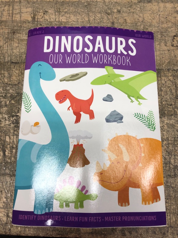 Photo 1 of dino our world work book 