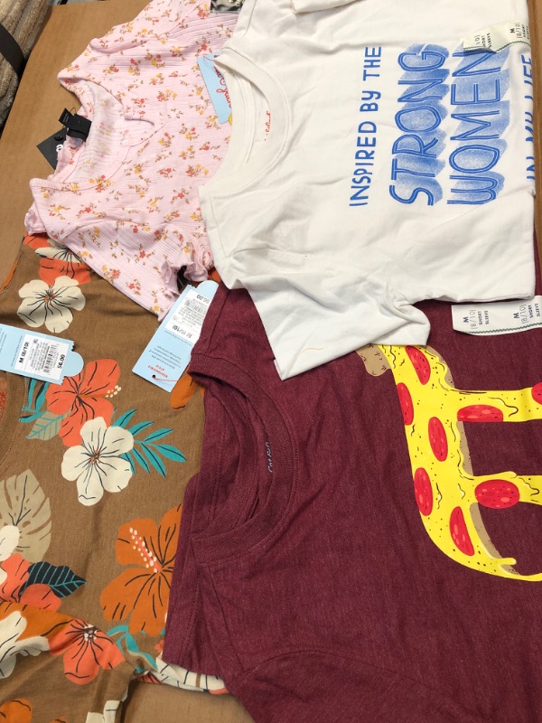 Photo 1 of Bundle of 4- assorted kids shirts- size medium 