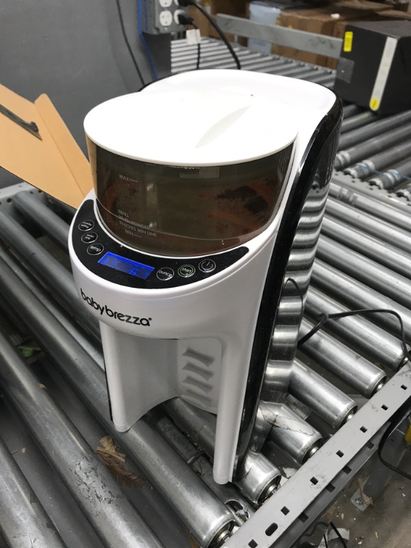 Photo 1 of New and Improved Baby Brezza Formula Pro Advanced Formula Dispenser Machine - Automatically Mix a Warm Formula Bottle Instantly - Easily Make Bottle with Automatic Powder Blending