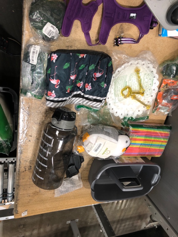 Photo 1 of 14 pack of Assorted Home Good Supplies and Accessories; God Harness, Mounting Tape, Shower Caddys, Water Bottle, Stuffed Animal and Gun Holdster items. 
