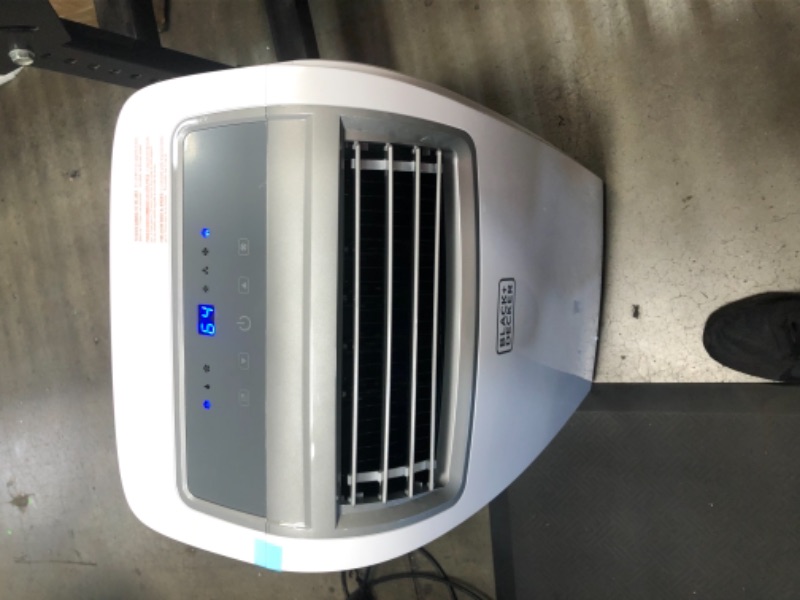 Photo 2 of BLACK+DECKER 14,000 BTU Portable Air Conditioner with Remote Control, White

-powers on blows ice cold 