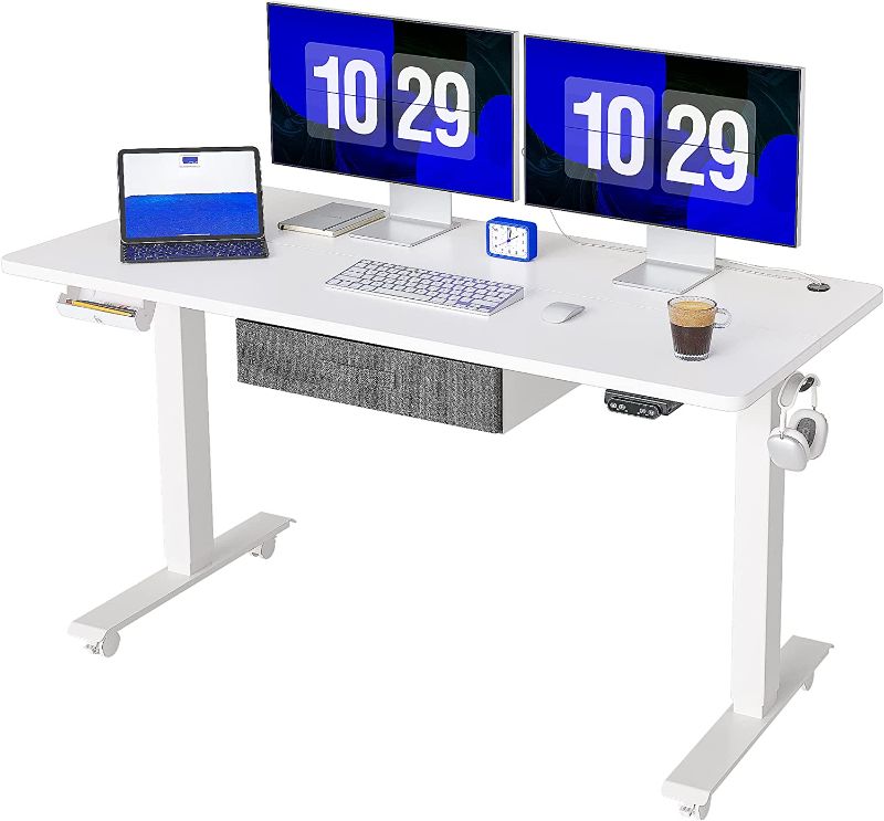 Photo 1 of FEZIBO Standing Desk with Drawer, Adjustable Height Electric Stand up Desk, 55 x 24 Inches Sit Stand Home Office Desk, Ergonomic Workstation White Steel Frame/White Tabletop
