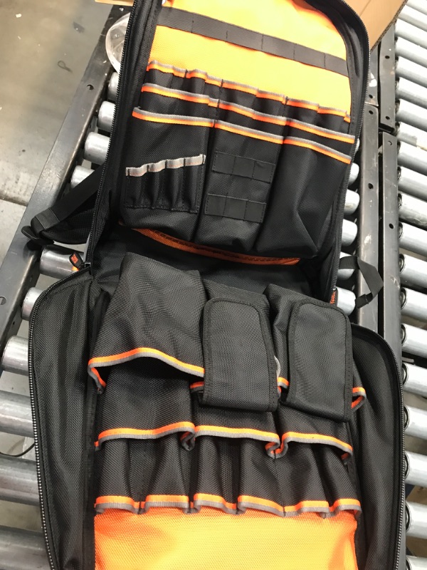 Photo 3 of Klein Tools Tradesman Pro Tool Bag Backpack, 39 Pockets, Black, 14-Inch, Black and Orange with a Bright Orange Interior
