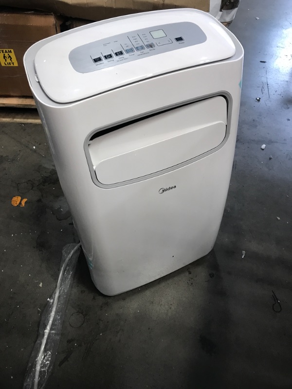 Photo 1 of **DAMAGED **NON FUNCTIONAL* Midea 14,000 BTU ASHRAE (8,200 BTU SACC) Portable Air Conditioner, Cools up to 375 Sq. Ft., Works as Dehumidifier & Fan, Control with Remote, Amazon Alexa & Google Assistant
