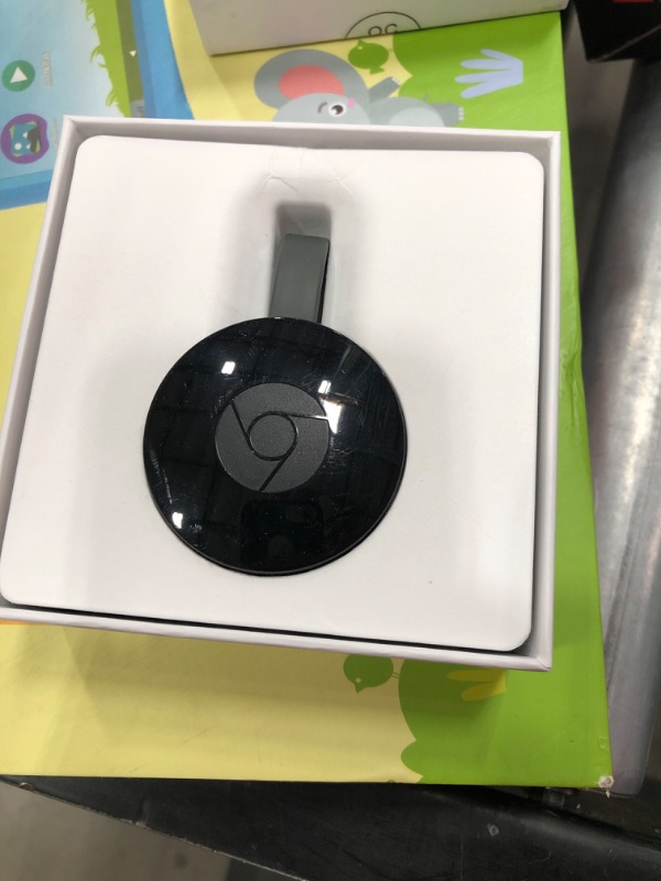 Photo 2 of Google Chromecast - Streaming Device with HDMI Cable - Stream Shows, Music, Photos, and Sports from Your Phone to Your TV
