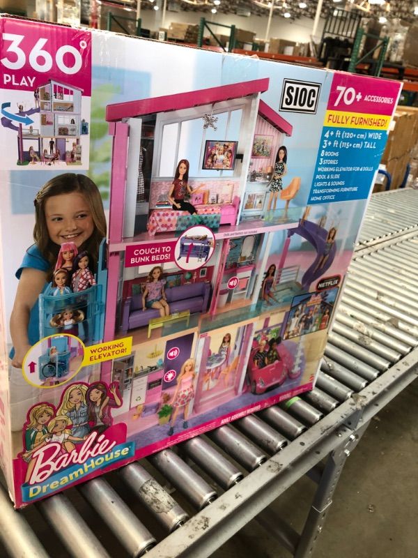 Photo 1 of Barbie Dreamhouse Dollhouse with Wheelchair Accessible Elevator, Pool, Slide and 70 Accessories Including Furniture and Household Items, Gift for 3 to 7 Year Olds
