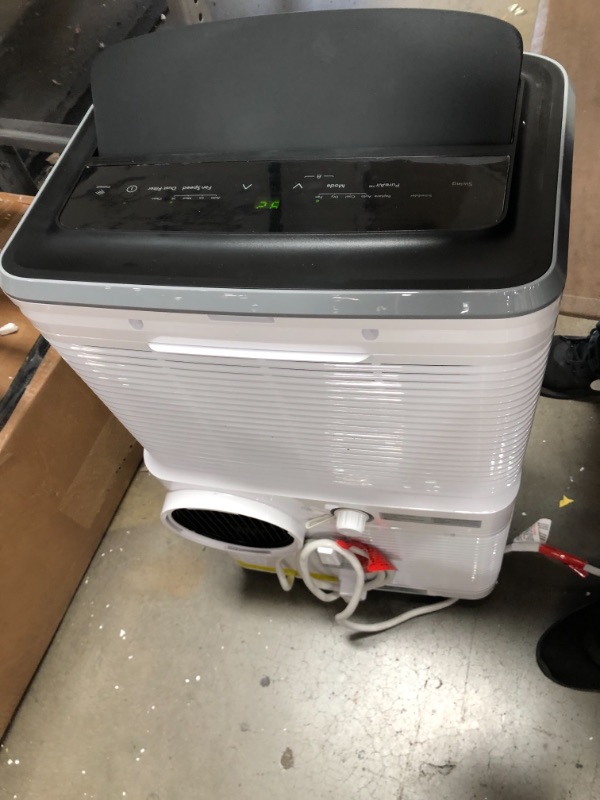Photo 1 of FHPW122AC1 Portable Air Conditioner with 12000 BTU Cooling Capacity 115 Volts 11 Amps 7.2 CEER Remote and 3 Fan
**SIDE IS CRACKED OPEN**
