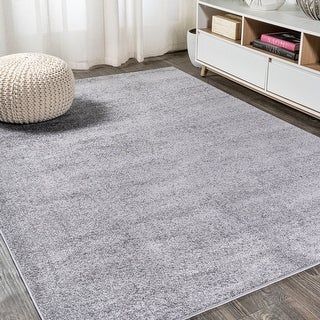 Photo 1 of 5'x8' Haze Solid Low-Pile Area Rug, Gray - JONATHAN Y
