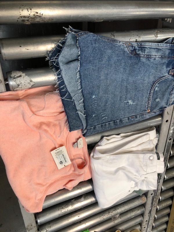 Photo 1 of BUNDLE OF WOMEN'S CLOTHING SHORTS(SIZE:12), PANTS(SIZE: 12), AND A SHIRT ( SMALL)