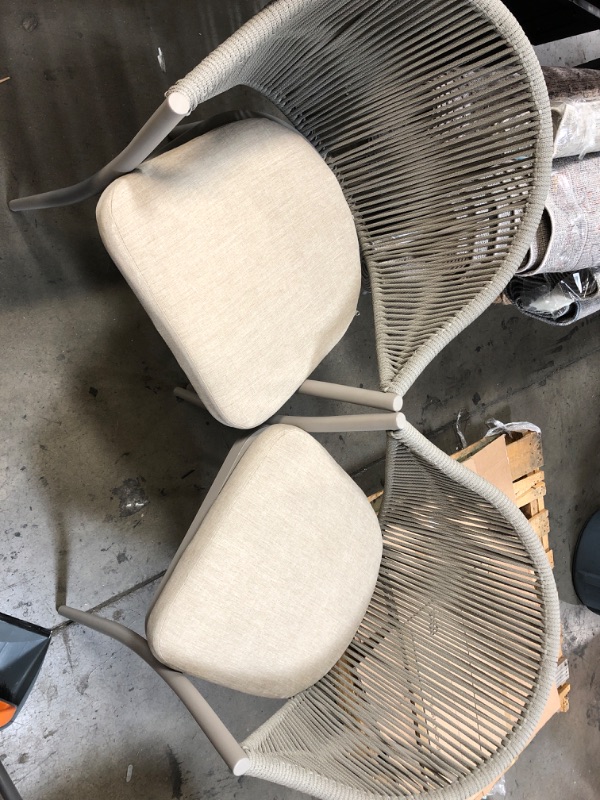 Photo 1 of 2 set of patio chairs 

**one leg is damaged 