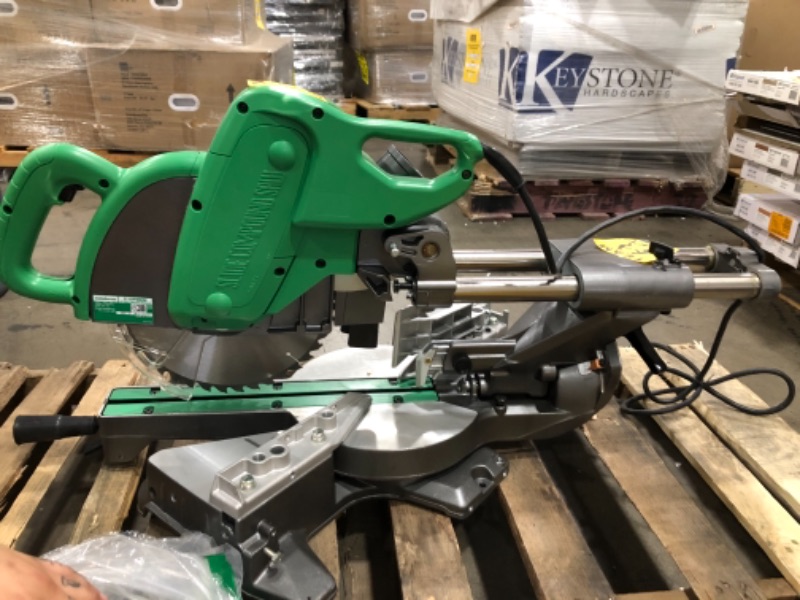 Photo 2 of **NONFUNCTIONAL**
Metabo HPT 10-Inch Sliding Compound Miter Saw, Double-Bevel, Electronic Speed Control, 12 Amp Motor, Electric Brake, 5-Year Warranty (C10FSBS)
