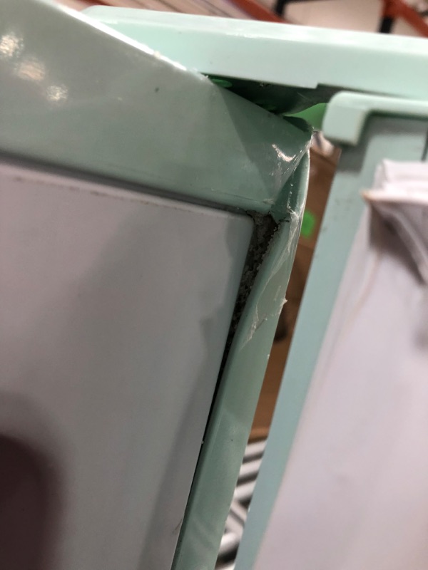 Photo 3 of ***PARTS ONLY*** (MULT. DENTS; CRACKED DOOR CORNER; DAMAGED FREEZER DOOR HINGE) Frigidaire EFR753-MINT 2 Door Apartment Size Refrigerator with Freezer, 7.5 cu ft, Retro, Mint
