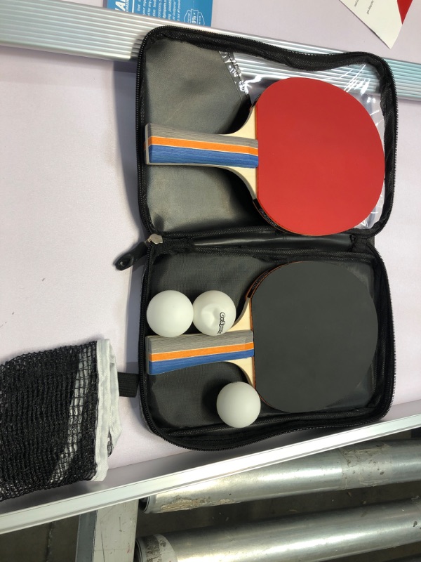 Photo 1 of NEEDS REPAIR**GoSports Mid-Size Table Tennis Game Set - Indoor/Outdoor Portable Table Tennis Game with Net, 2 Table Tennis Paddles and 4 Balls

