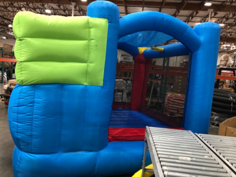 Photo 4 of Bounceland Royal Palace Inflatable Bounce House, with Long Slide, Large Bouncing Area, Basketball Hoop and Sun Roof, 13 ft x 12 ft x 9 ft H, UL Strong Certified Blower, Castle Kids Party Theme
