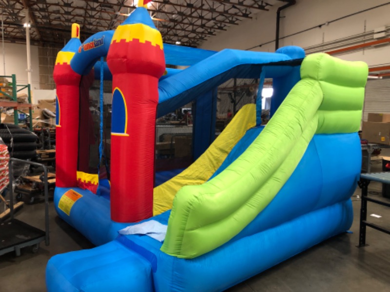 Photo 5 of Bounceland Royal Palace Inflatable Bounce House, with Long Slide, Large Bouncing Area, Basketball Hoop and Sun Roof, 13 ft x 12 ft x 9 ft H, UL Strong Certified Blower, Castle Kids Party Theme
