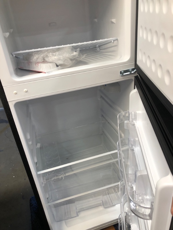 Photo 4 of **DENTED** Frigidaire 7.2 Cu. Ft. Top Freezer Stainless Steel Apartment Size Refrigerator
