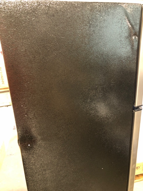 Photo 2 of **DENTED** Frigidaire 7.2 Cu. Ft. Top Freezer Stainless Steel Apartment Size Refrigerator
