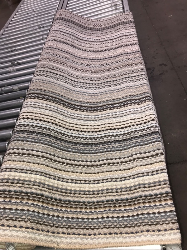 Photo 1 of 5' x 7'6"  kintted biege rug 