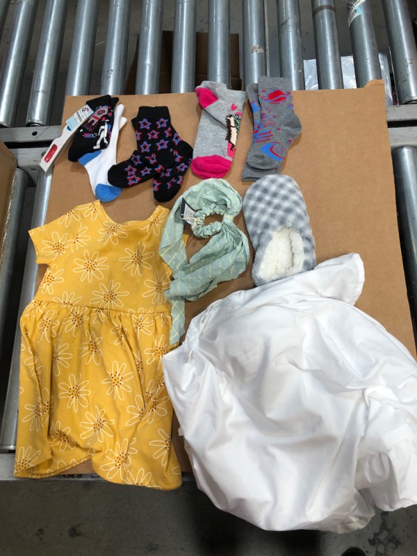 Photo 1 of Miscellaneous Bundle: 5 pairs of children's socks; 1 plastic glasses; 1 girls 2T dress; 1 headband; 1 pillowcase; 5 earrings (not complete set of earrings); 1 slipper (missing other slipper) 