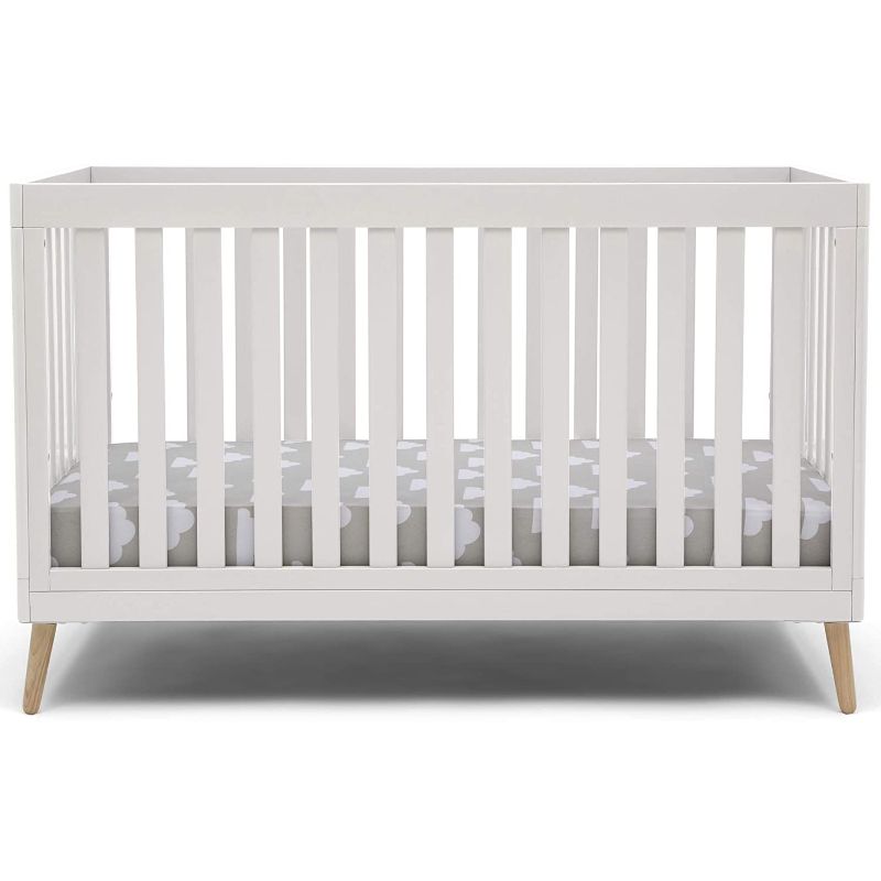 Photo 1 of Delta Children Essex 4-in-1 Convertible Baby Crib, Bianca White with Natural Legs
