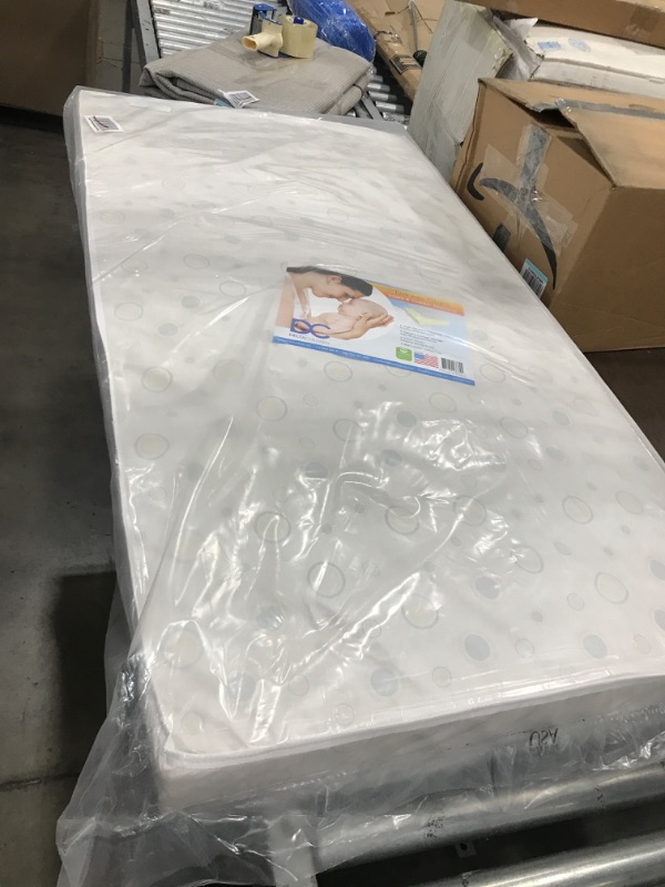 Photo 2 of Delta Children Twinkle Stars Dual Sided - Premium Sustainably Sourced Fiber Core Crib and Toddler Mattress - Waterproof - GREENGUARD Gold Certified (Non-Toxic) - 7 Year Warranty - Made in USA
