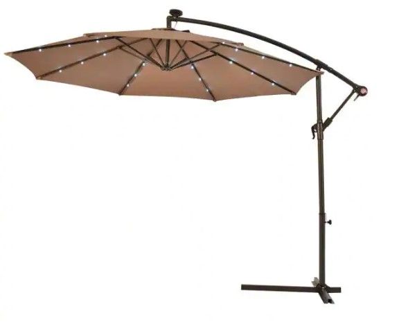 Photo 1 of 10 ft. Steel Cantilever Solar Tilt Patio Umbrella with LED Lights and Cross Base in Tan
