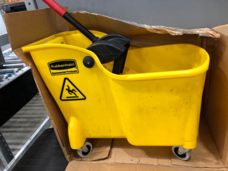 Photo 3 of **MINOR DAMAGE** Rubbermaid Commercial Products, Mop Bucket with Wringer on Wheels, Heavy Duty All-in-One Tandem Mopping Bucket, Yellow, 31 Quart (FG738000YEL)
