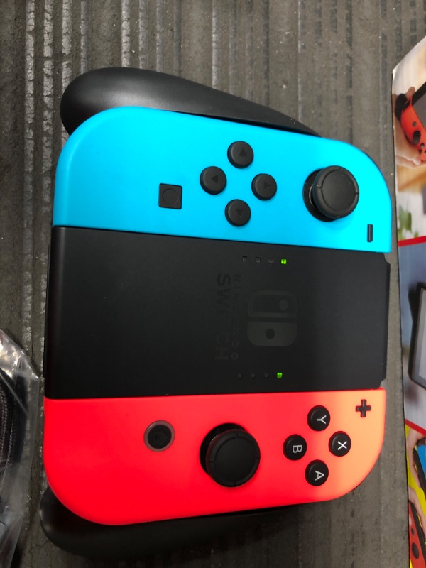 Photo 6 of Nintendo Switch with Neon Blue and Neon Red Joy-Con

