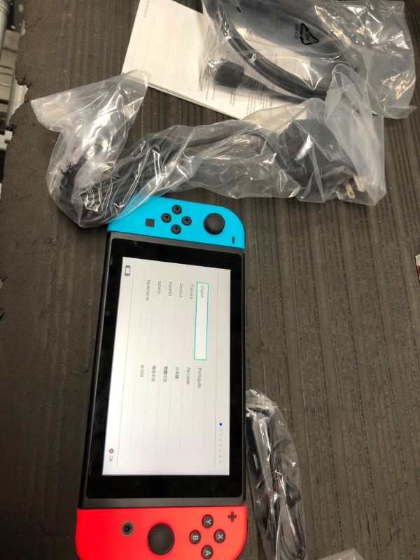 Photo 2 of Nintendo Switch with Neon Blue and Neon Red Joy-Con

