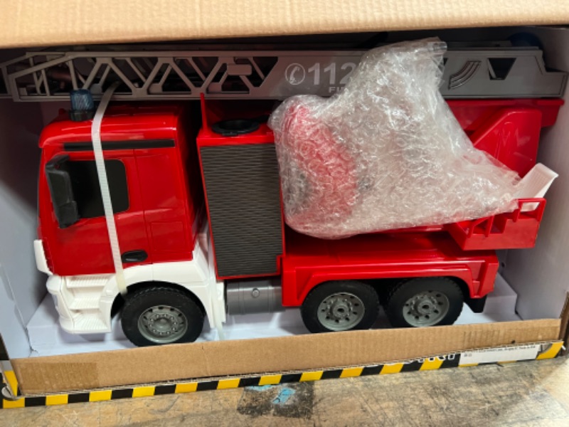 Photo 2 of DOUBLE E Benz Licensed Remote Control Fire Truck Shoots Water Extendable 18 Inch Rescue Ladder 10 Channel Fire Engine Working Sounds Lights RC Trucks for Kids
