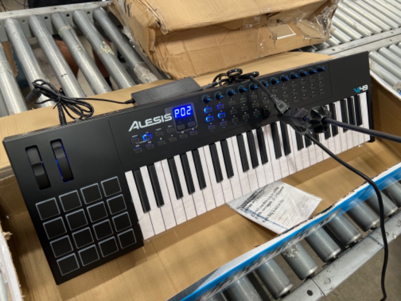 Photo 2 of Alesis VI49 - 49 Key USB MIDI Keyboard Controller with, 16 Drum Pads, 12 Assignable Knobs, 36 Buttons and 5-Pin MIDI Out, Production Software Included
