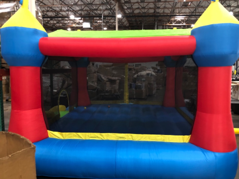 Photo 2 of Bounceland Inflatable Party Castle Bounce House Bouncer, 16 ft L x 13 ft W x 10.3 ft H, Basketball Hoop, Removable Sun Roof, UL Strong Blower included, Fun Slide and Bounce Area, Castle Theme for Kids
