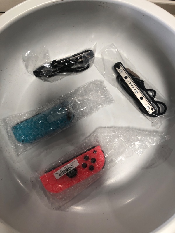 Photo 2 of Nintendo Switch Joy-Con L/R Controller Pair (Neon Red/Neon Blue)
