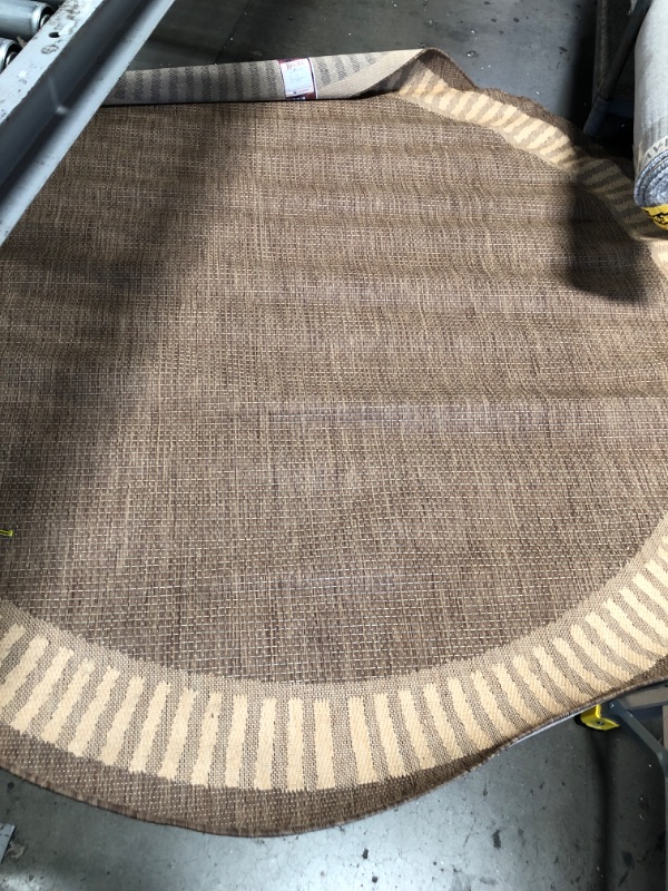 Photo 1 of 7' ROUND BROWN WOVEN RUG