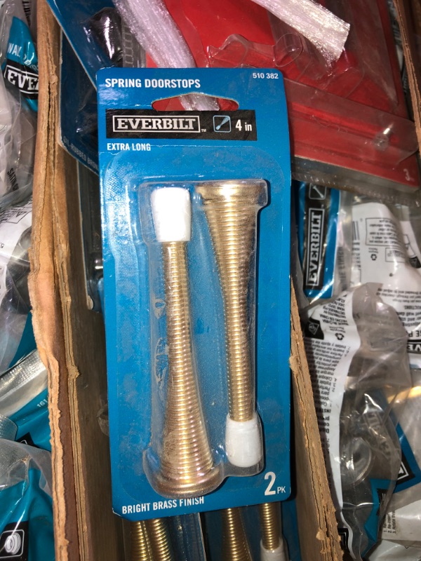 Photo 9 of **SOLD AS IS**-Pallet of assorted home improvement hardware, door stoppers, door spring stoppers and hardware , assorted colors ,sizes and design