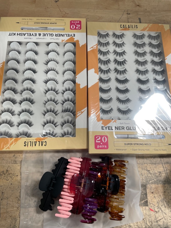 Photo 1 of **** BUNDLE OF MISC. (2PACK OF EYE LASHES AND  6 PIECES OF HAIR CLIPS)*** SOLD AS IS*** NO RETURNS*** NO REFUNDS***