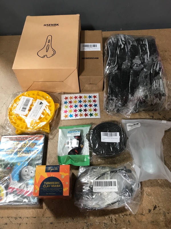 Photo 1 of **NON-REFUNDABLE** Amazon Goods, Miscellaneous Items. Bike Seat, Home Goods, Toys and Electronics, and Biodegradable Urn, MASKS and Pet Food Spoon 