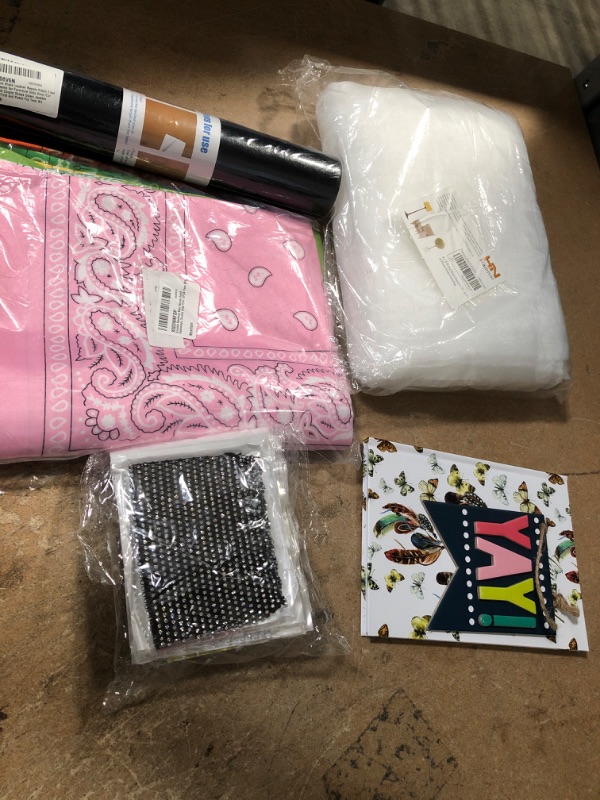 Photo 1 of ** AMAZON BUNDLE OF BOTEBOOK, LEATHER PATCH TAPE , BUG NET AND BANDANA ***