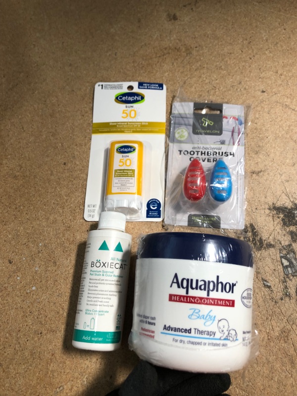 Photo 1 of *Aquaphor - EXPIRES April 2023*
Miscellaneous Bundle (scented stain & odor remover, sunscreen stick, 2 pack toothbrush covers, and baby Aquaphor) 