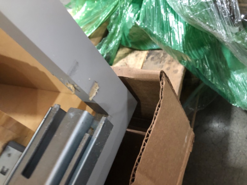 Photo 1 of (PARTS ONLY: MAJOR DAMAGE: breaks, dents, scratched)
sink/range base, base cabinet, draw base 3 doors- standard depth stock gray painted shaker