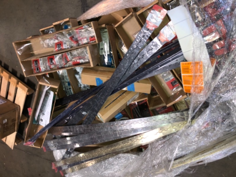 Photo 1 of -NONREFUNDABLE -SOLD AS IS ! Pallet of assorted door stoppers ,hinges , wall posts , sling door stoppers , solid and vanished stoppers , assorted styles, sizes and colors 