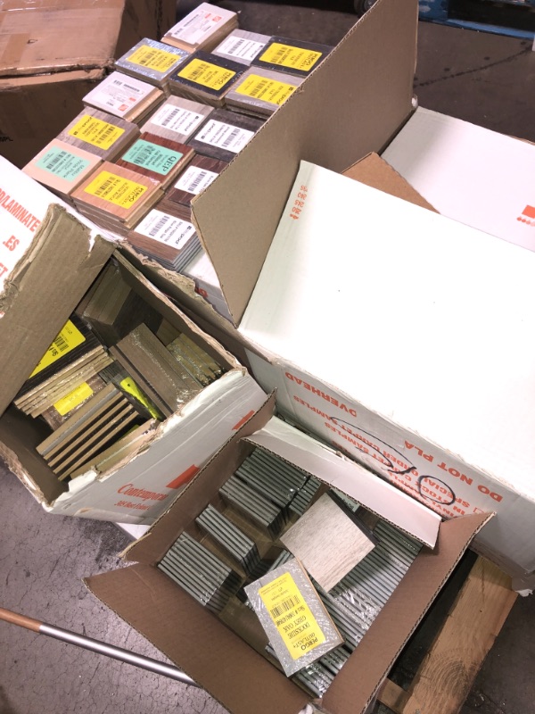 Photo 1 of -NONREFUNDABLE -SOLD AS IS ! 
Pallet of assorted Pergo Outlast Waterproof Laminate Wood Flooring vinyl samples, assorted colors and sizes, more than 15 different shades 