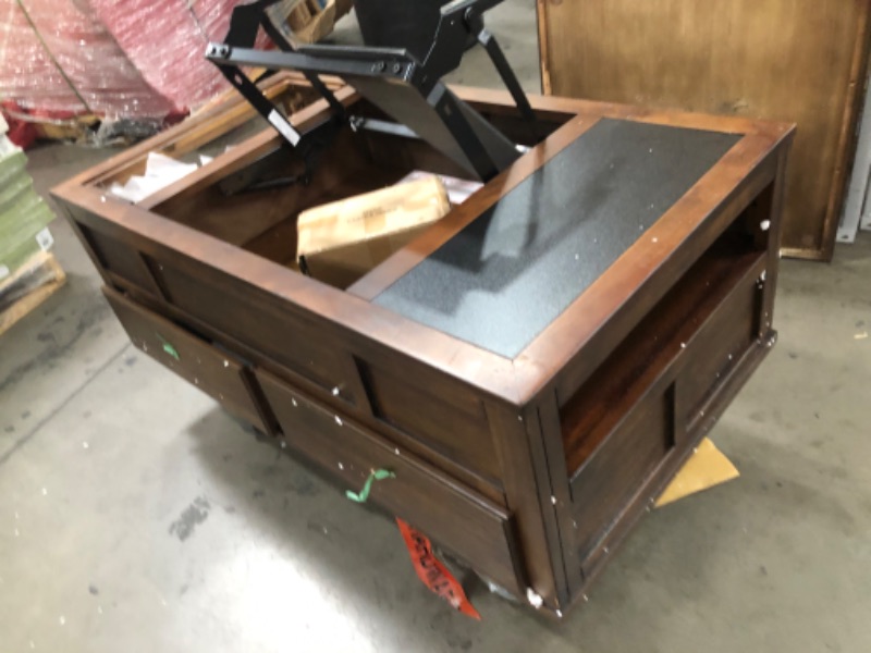 Photo 3 of (DAMAGED TOP/FRAME) 
Signature Design by Ashley Gately Traditional Rectangular Lift Top Coffee Table with 2 Drawers and 2 Storage Cubbies, Brown
