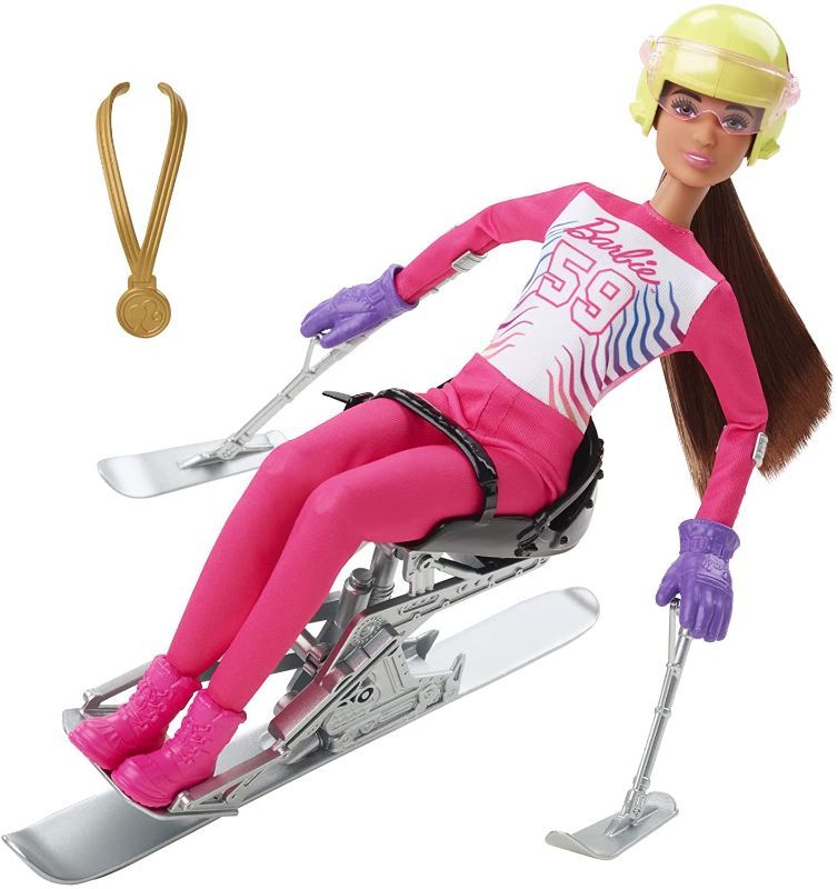 Photo 1 of 4 pack - Barbie Winter Sports para Alpine Skier Brunette Doll (12 in) with Shirt, Pants, Helmet, Gloves, Pole, Sit Ski & Trophy, Great Gift for Ages 3 and Up
